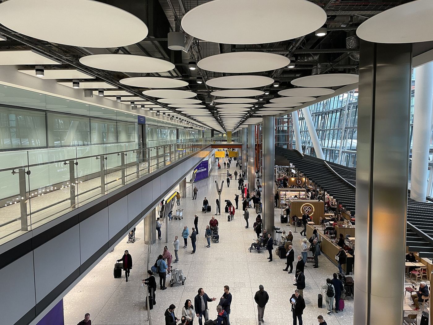 The arrivals hall at Heathrow Terminal 5, where private drivers meet cruise passengers